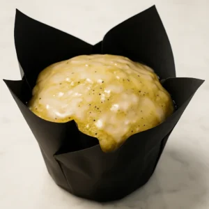 Jumbo lemon poppyseed muffin with lemon glaze, freshly baked by Moonlight Bakery