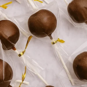 chocolate cake pops in wrapper with golden tie