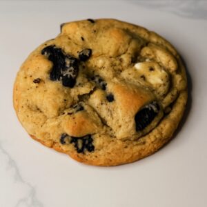 Freshly baked Lunar Eclipse Cookie — a chewy cookies-and-cream treat from Moonlight Bakery with a gothic celestial twist.